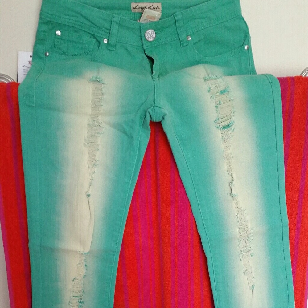 Bright green distressed skinny jeans